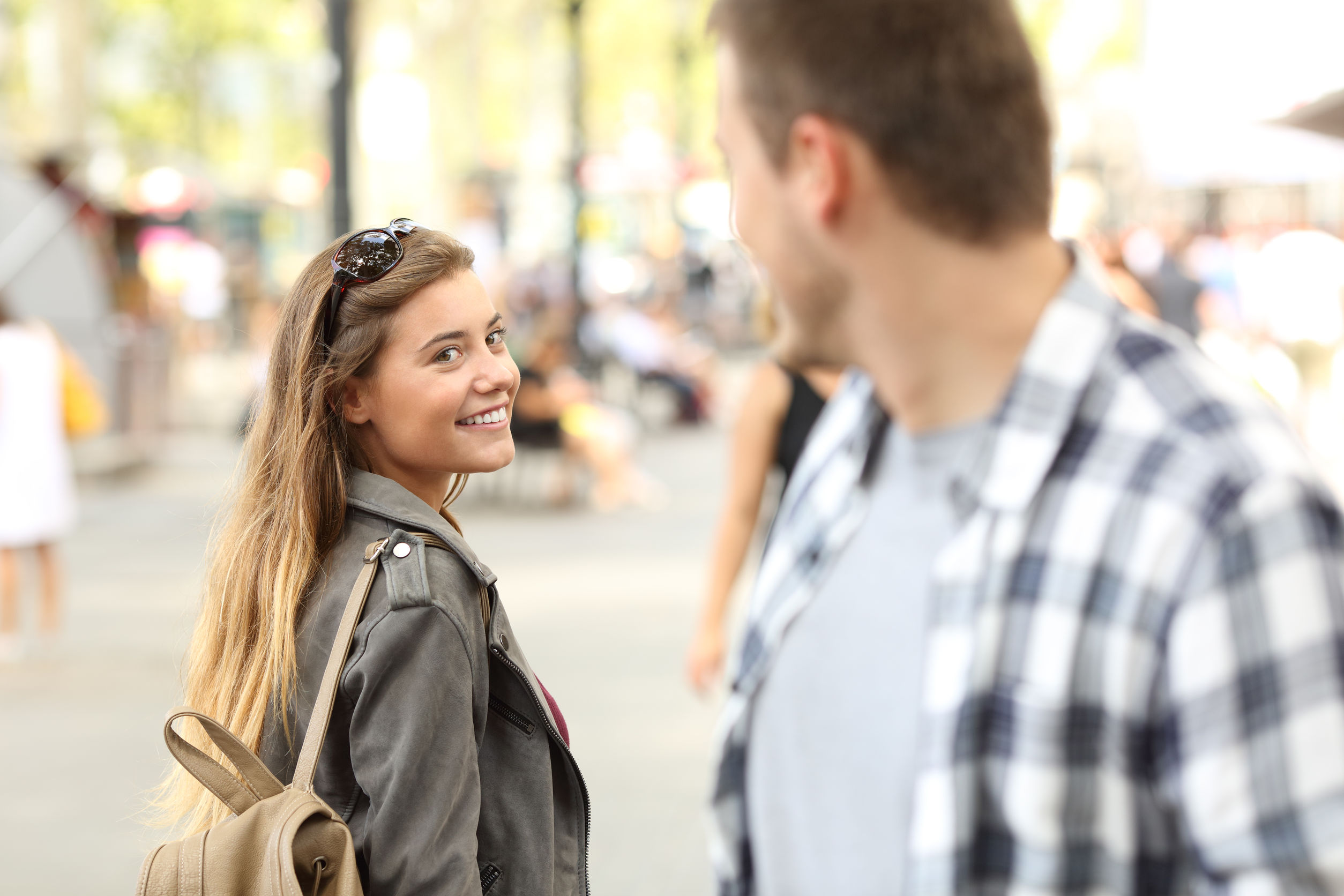Strangers Girl And Guy Flirting On The Street.