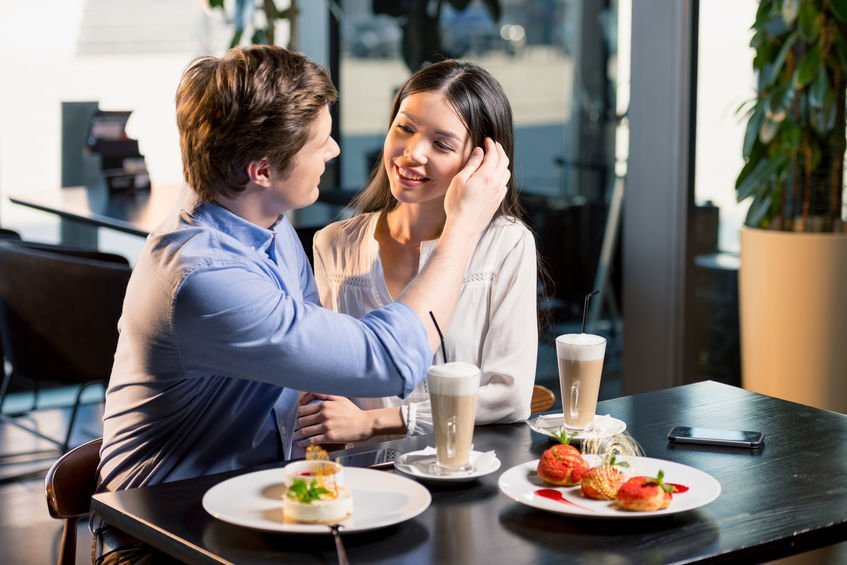 Happy Young Couple In Love At Romantic Date In Restaurant – Kevin Hogan